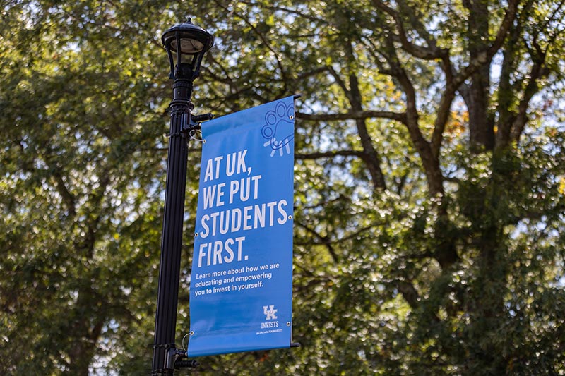 A University of Kentucky campus banner reading At UK, we put students first